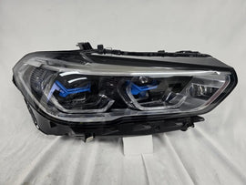 This image displays the right-side Laser headlight for BMW models X5 G05, X5 M F95, X6 G06, and X6 M F96, featuring OEM genuine quality with part number 5A27998. This used original headlamp delivers cutting-edge BMW Laserlight technology, offering enhanced night visibility, precise fitment, and a sleek, high-performance design tailored for these luxury SUV models.