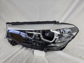 This image shows the left-side LED headlight for the BMW 5 Series G30 and G31 models, featuring OEM genuine quality with part number 7439199. This used original headlamp is engineered for a precise fit on the left side, offering bright and efficient LED illumination, modern styling, and the reliable performance expected from BMW components.