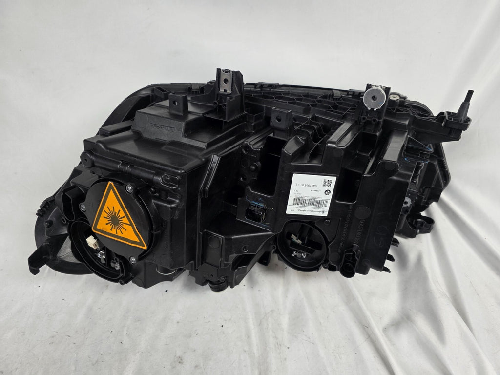 This image displays the right-side Laser headlight for BMW models X5 G05, X5 M F95, X6 G06, and X6 M F96, featuring OEM genuine quality with part number 5A27998. This used original headlamp delivers cutting-edge BMW Laserlight technology, offering enhanced night visibility, precise fitment, and a sleek, high-performance design tailored for these luxury SUV models.