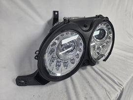 This image shows the left-side headlight for the 2014–2019 Bentley Flying Spur, featuring OEM genuine quality with part number 4W1941015H. This used original headlamp is in excellent condition, offering premium illumination, elegant design, and a precise fit for Bentley’s high-end luxury sedan