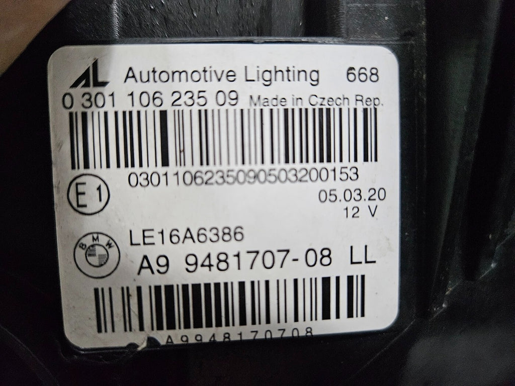 Genuine used BMW Laser headlight for 3 Series models G20 and G21. This left-side OEM headlamp, part number 9481707, features high-performance laser lighting technology for superior road visibility and driving precision. The image showcases the original left laser headlight in used condition, clearly showing the lens structure, housing, and connector ports — ideal for replacing a damaged headlamp on compatible BMW 3 Series vehicles.

