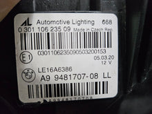 Load image into Gallery viewer, Genuine used BMW Laser headlight for 3 Series models G20 and G21. This left-side OEM headlamp, part number 9481707, features high-performance laser lighting technology for superior road visibility and driving precision. The image showcases the original left laser headlight in used condition, clearly showing the lens structure, housing, and connector ports — ideal for replacing a damaged headlamp on compatible BMW 3 Series vehicles.

