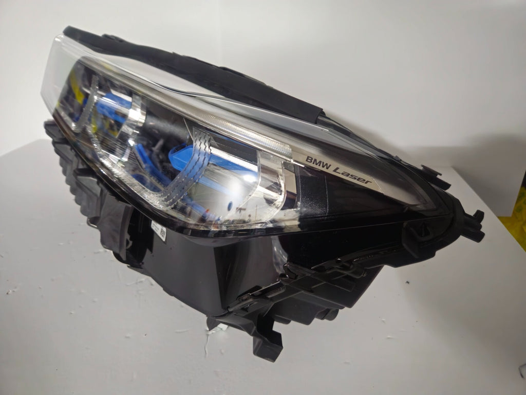 This image features the left-side Laser headlight for the BMW 7 Series G11 LCI and G12 LCI models, with OEM genuine quality and part number 9450229. Specifically designed for the facelifted (LCI) versions of the G11 and G12, this used original headlamp offers cutting-edge BMW Laserlight technology, precision fitment, and exceptional nighttime visibility, perfectly aligning with the luxury and performance of the 7 Series