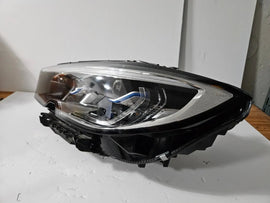Genuine used BMW Laser headlight for 3 Series models G20 and G21. This left-side OEM headlamp, part number 9481707, features high-performance laser lighting technology for superior road visibility and driving precision. The image showcases the original left laser headlight in used condition, clearly showing the lens structure, housing, and connector ports — ideal for replacing a damaged headlamp on compatible BMW 3 Series vehicles.

