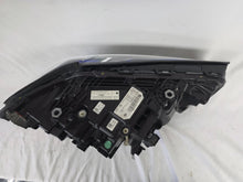 Load image into Gallery viewer, Genuine OEM BMW Laser headlight for 5 Series models G30, G31, and F90 LCI (facelift). This left-side headlamp, part number 5A388D5, is equipped with advanced laser lighting technology for superior visibility and precision on the road. The image displays the original left laser headlight in used condition, clearly showing the lens structure, cooling fins, mounting points, and connector ports — ideal for OEM replacement on compatible BMW 5 Series LCI vehicles.

