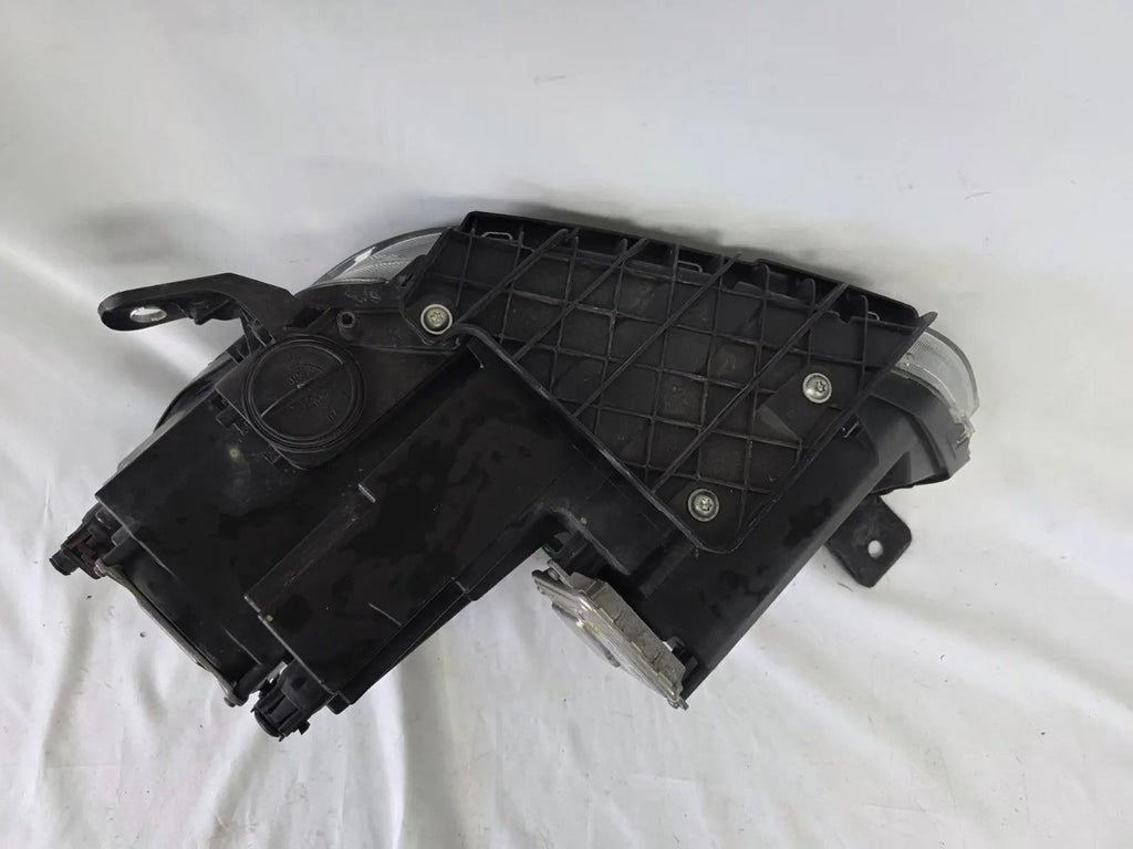 This image shows the right-side Xenon headlight for the Maserati Ghibli models from 2014 to 2017, featuring OEM genuine quality with part number 00670004658. This used original headlamp is designed for perfect fitment, delivering powerful Xenon lighting and the signature sleek styling expected from Maserati’s luxury performance vehicles