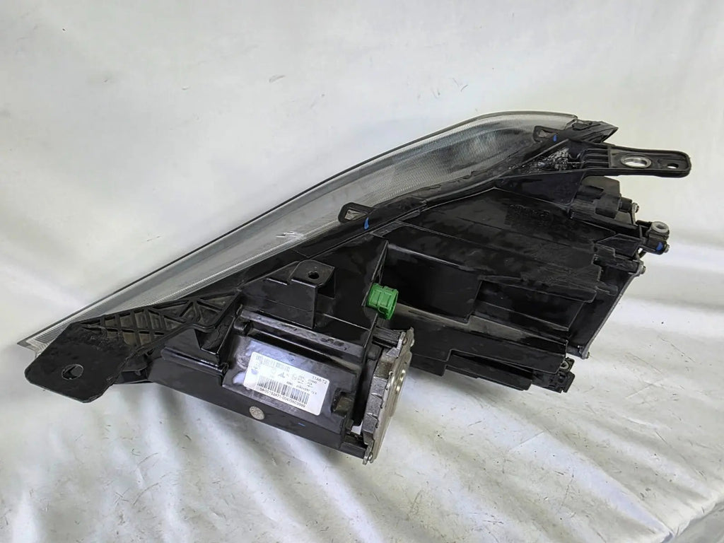 This image shows the right-side Xenon headlight for the Maserati Ghibli models from 2014 to 2017, featuring OEM genuine quality with part number 00670004658. This used original headlamp is designed for perfect fitment, delivering powerful Xenon lighting and the signature sleek styling expected from Maserati’s luxury performance vehicles