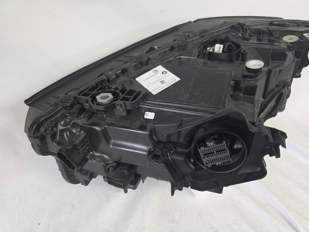 Genuine OEM Adaptive LED headlight for BMW iX3 and compatible models including G08, G01, F97, G02, and F98 with LCI (facelift) updates. This right-side headlamp, part number 5A29204, features adaptive lighting technology for enhanced road illumination and driving safety. The image showcases the original right LED headlight in used condition, clearly showing the lens, housing, and connector points — perfect for replacement on BMW iX3 and related LCI models.