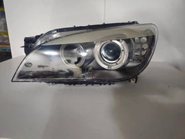 This image features the left-side Xenon headlight for the BMW 7 Series F01/F02 models, showcasing used OEM genuine quality with part number 7225229. Designed specifically for the F01 and F02 chassis, this original headlamp offers high-intensity Xenon lighting and precise fitment for the left side, ensuring reliable performance and compatibility.