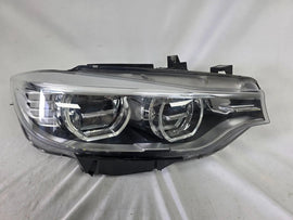 Genuine used BMW Adaptive LED headlight for 4 Series models F32, F33, F36, F80 LCI, F82, and F83. This right-side OEM headlamp, part number 7377842, is designed with adaptive lighting technology for improved visibility and performance. The image highlights the complete original headlight unit in used condition, including the clear lens, mounting points, and electrical connectors — ideal for replacement on compatible BMW models.